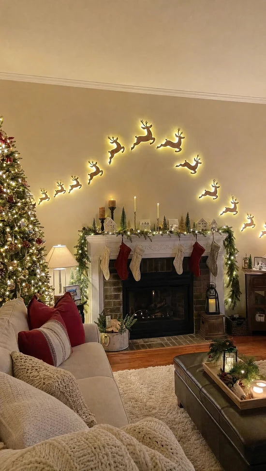 Glowing ReinGlow reindeer arching across a living room wall above the fireplace